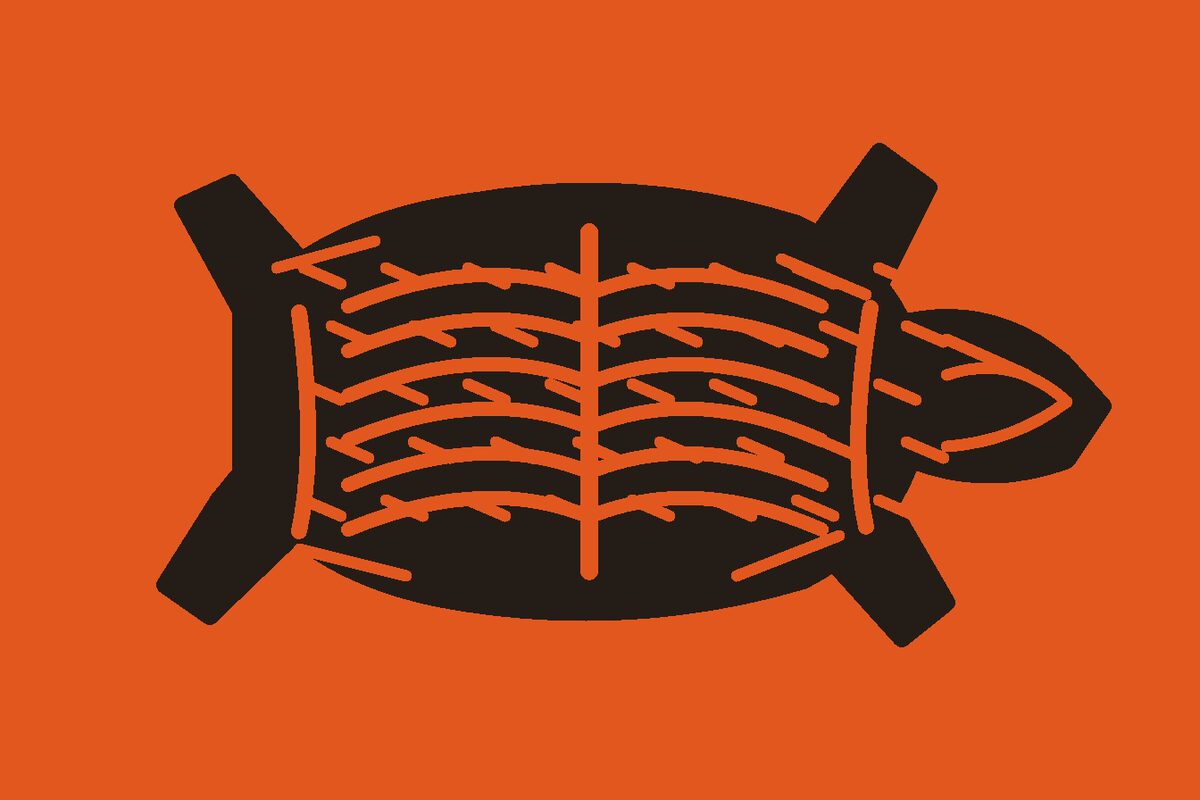 Two-colour linocut illustration of an overhead cooked dressed whole hog with four splayed legs, tapered head, open ribcage, and bark hatching